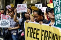 Press freedom advocates hold a protest outside the Department of Justice building in Manila on Wednesday, 21 January 2026, calling anew for the release of detained journalist Frenchie Mae Cumpio as Tacloban City regional trial court branch 45 is set to issue a verdict on her trial on Thursday, 22 January.
Cumpio, a community investigate journalist for news site Eastern Vista, was arrested in 2020 along with four others during a raid by the authorities in their office in Tacloban City. They are facing charges of illegal possession of firearms and explosives and financing terrorism.
