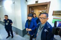Dismissed Bulacan district engineer Henry Alcantara is being escorted by authorities out of the Senate building, where he has been detained since September last year after being cited in contempt in relation to the flood control scam. He has been admitted as a state witness.