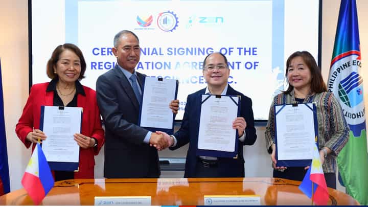 PEZA Director General Tereso Panga (3rd from left) and Zen LifeSciences Inc. President Maximo Ponce Balajadia (2nd from left) shakes hand after signing the registration agreement. PEZA Deputy Director General Vivian Santos (4th from left) and Zen LifeSciences Board Chair Zenaida Balajadia served as witnesses during the agreement signing.