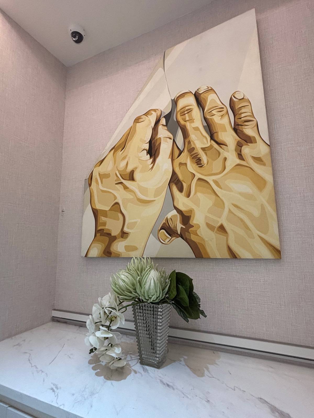 ARTWORKS and flowers brighten the space.