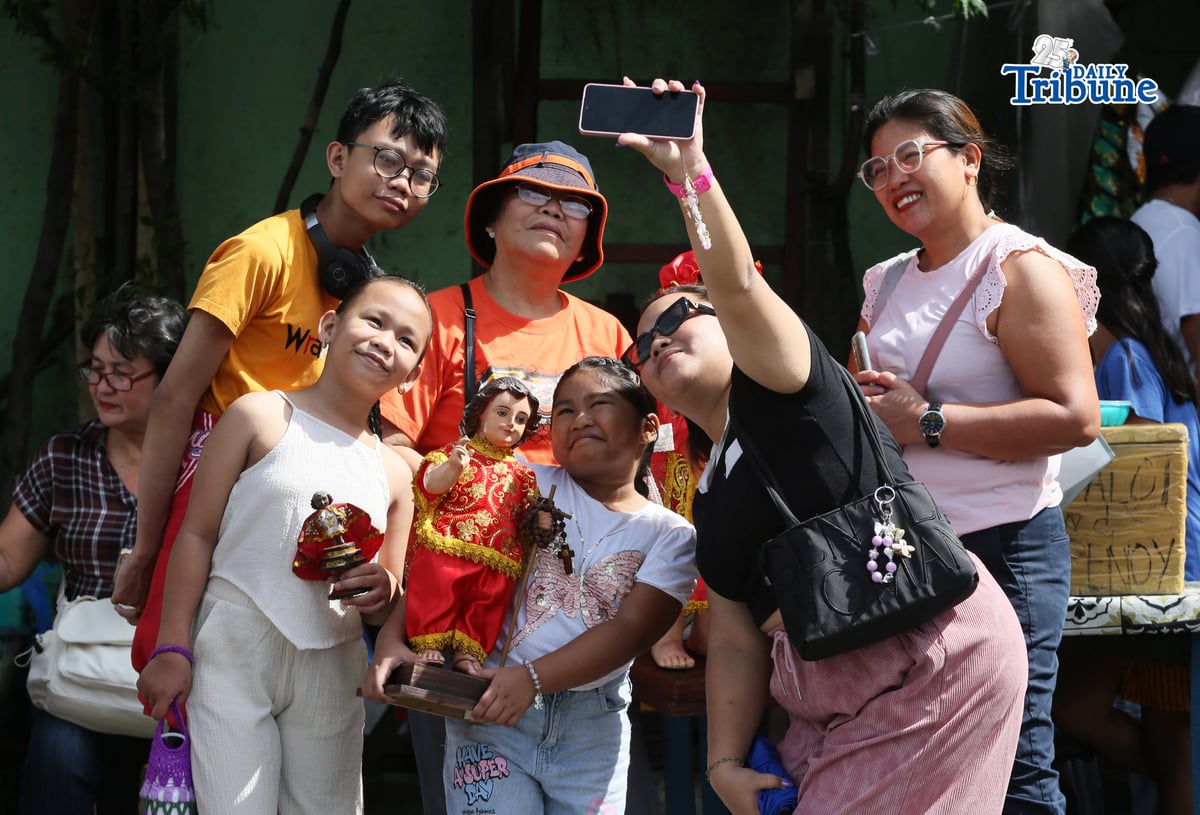 Devotees carry their own images of the Santo Niño as they join the fluvial and solemn foot procession of the Santo Niño de Cebu at Muelle Loney in Iloilo City on Friday, January 23, as part of the Feast of the Santo Niño and the 2026 Dinagyang Festival. Hundreds of faithful walked in prayer and thanksgiving as the revered image was escorted from the waterfront amid hymns, marking one of the festival’s most significant religious rites.