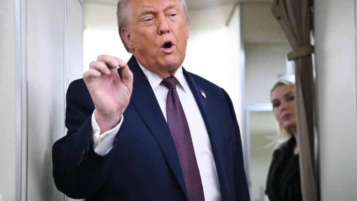 Iran warns ‘finger on trigger’ as Trump says Tehran wants talks