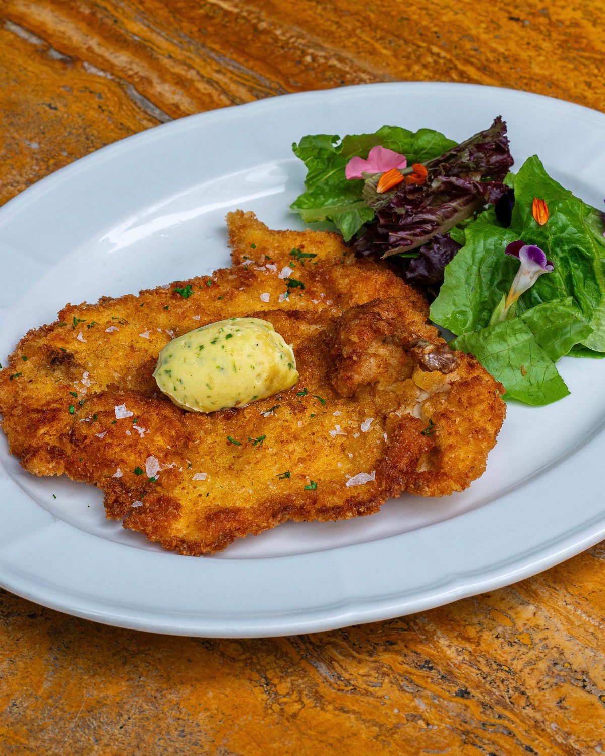 CHICKEN Schnitzel with Herb Garlic Butter.