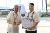 Subic Bay Metropolitan Authority (SBMA) Chairman and Administrator Eduardo Jose L. Aliño proudly holds the trophy and several Certificates of Recognition for its performance in the 2024 Quarterly Survey of Philippine Business and Industry with Norman L. Bundalian, Chief Statistical Specialist of the Philippine Statistics Authority (PSA)-Zambales and PSA personnel during the flag ceremony in front of the Administration Building 229 on January 19, 2026.