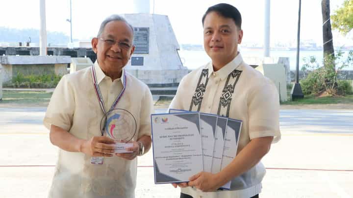 Subic Bay Metropolitan Authority (SBMA) Chairman and Administrator Eduardo Jose L. Aliño proudly holds the trophy and several Certificates of Recognition for its performance in the 2024 Quarterly Survey of Philippine Business and Industry with Norman L. Bundalian, Chief Statistical Specialist of the Philippine Statistics Authority (PSA)-Zambales and PSA personnel during the flag ceremony in front of the Administration Building 229 on January 19, 2026.