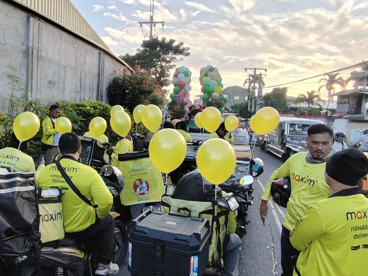 PARTICIPANTS from Maxim line up with other parade groups as the Batangas City Fiesta 2026 motorcade moves through residential roads ahead of the main celebration.