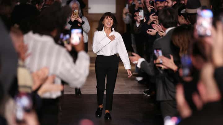 French fashion designer Véronique Nichanian gestures to the public at the end of her last show for Hermes' Menswear Ready-to-wear Fall-Winter 2026/2027 collection as part of the Men Paris Fashion Week in Paris on January 24, 2026.