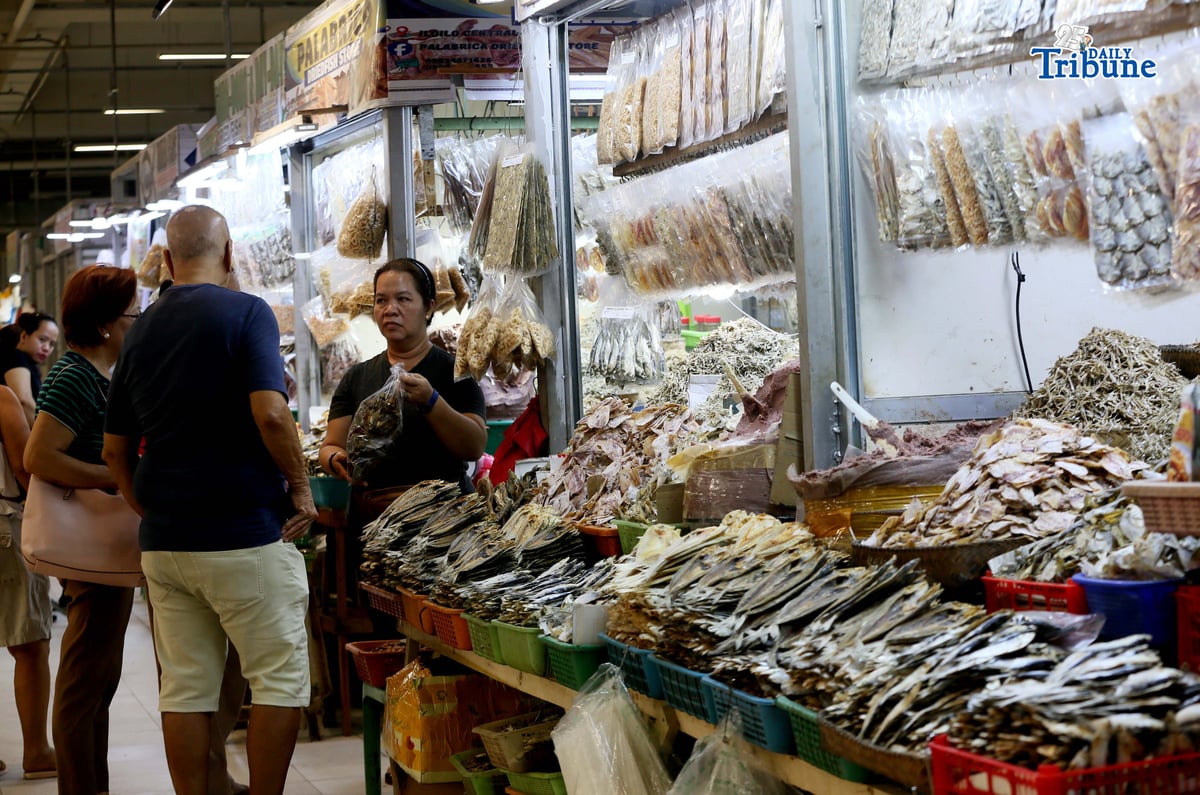 (January 26 2026) Dried fish vendor arranges and assisted of their customer buying dried fish at the new Iloilo terminal public market, the newly redeveloped Iloilo Central Market and Terminal Market, two of the city’s largest and most historic public spaces, in In partnership with the Iloilo City government, SM Prime. Fish and marine products are considered the main source of livelihood in the southern and northern Iloilo. Photo/Analy Labor