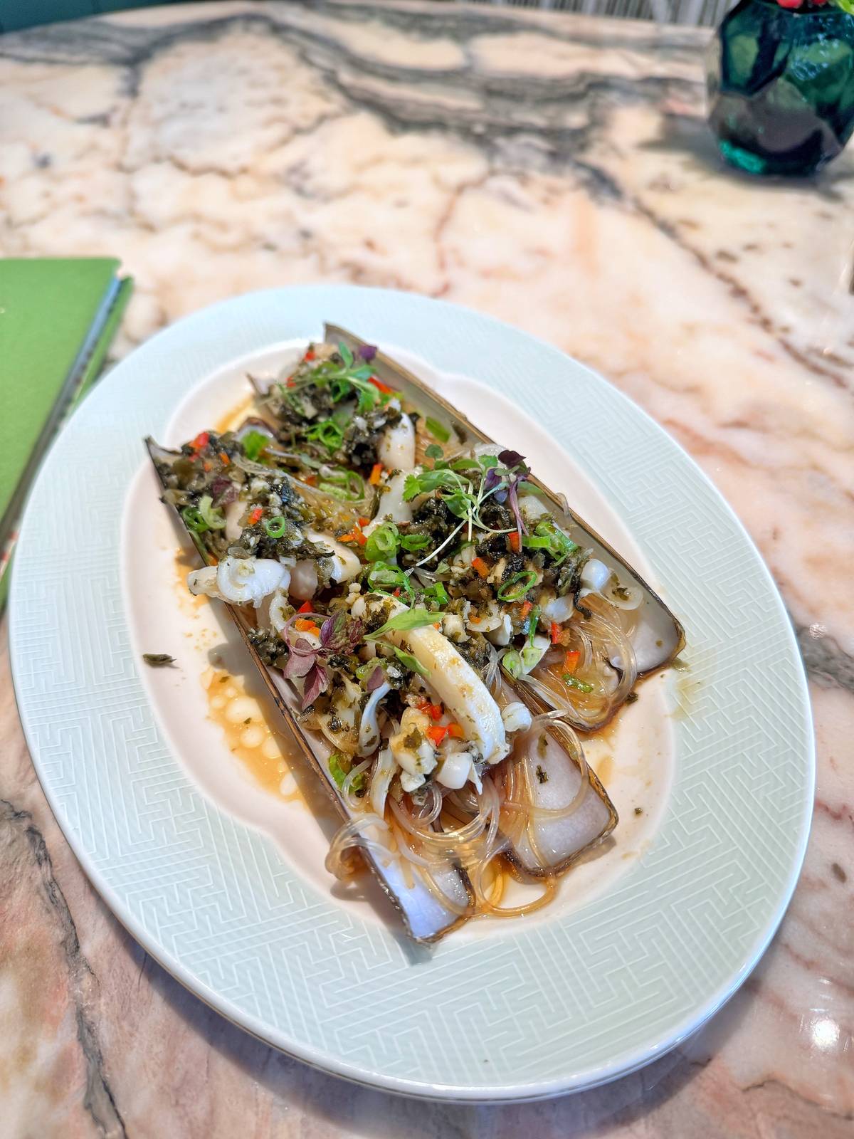STEAMED razor clam with Fujian pickled vegetable and garlic sauce.