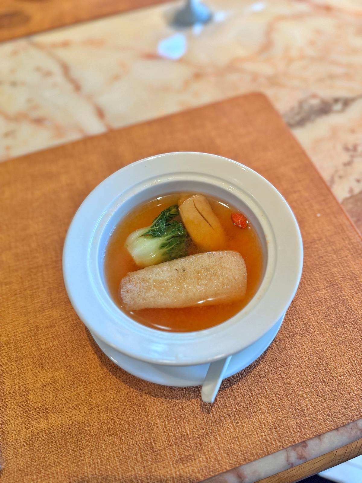 SIMMERED tomato broth with matsutake mushroom and bamboo fungus.