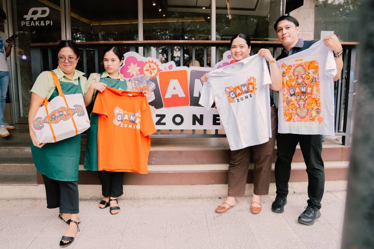 Festival-goers collect their GameZone prizes at the stations.