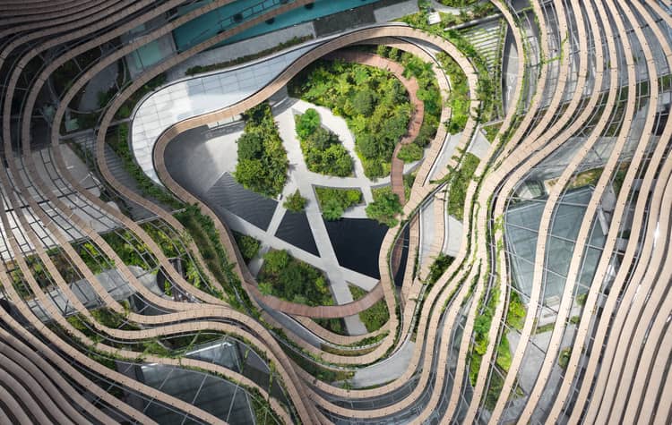 INSPIRED by Asian paddy field terraces, the green centre of Marina One, formed by the four towers.