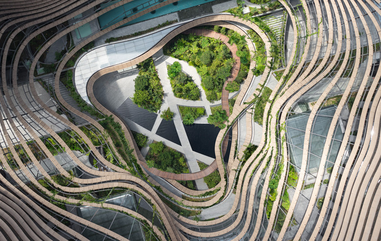 INSPIRED by Asian paddy field terraces, the green centre of Marina One, formed by the four towers.