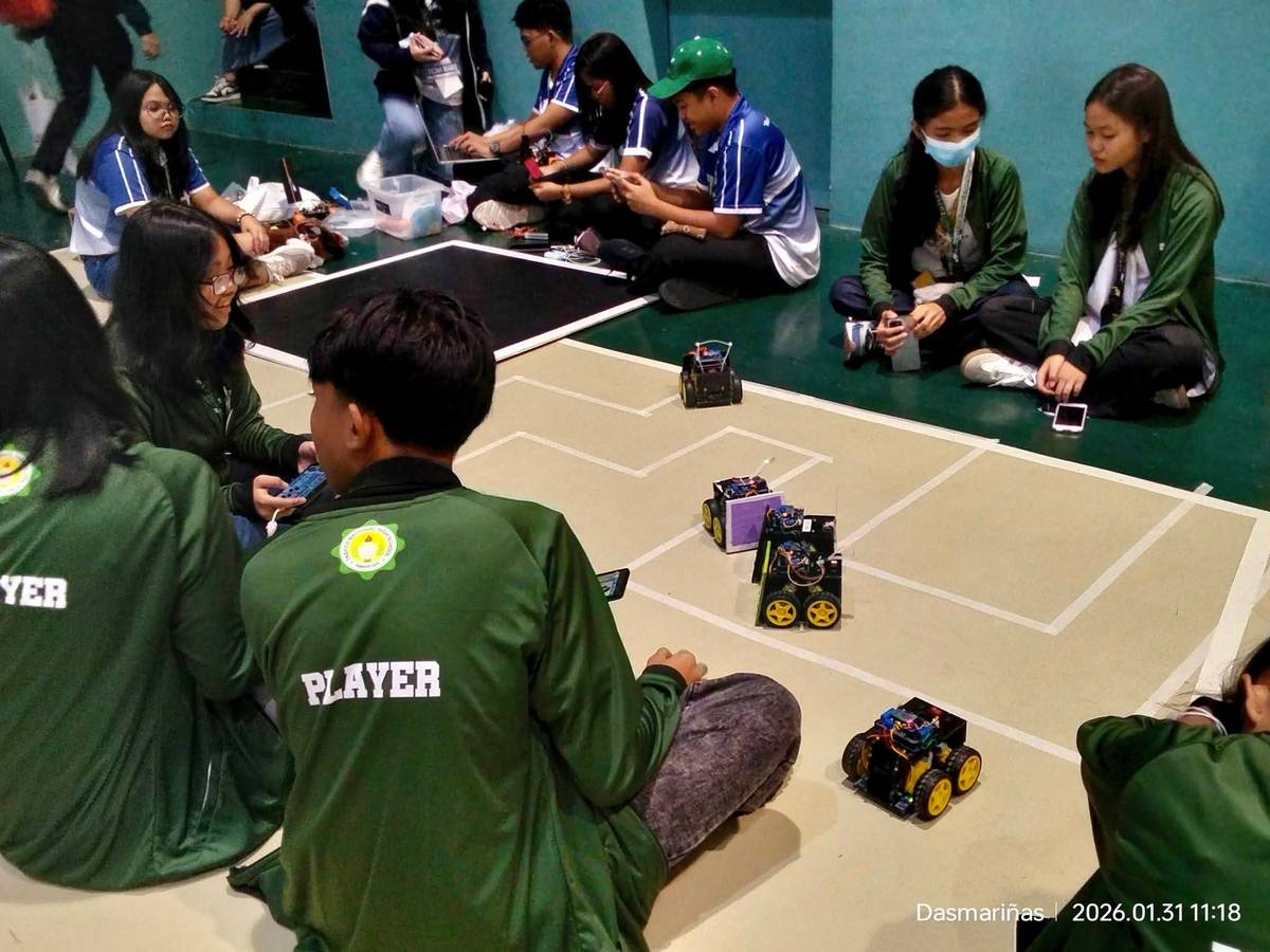 Tabaco National High School students practice on a makeshift maze path made of masking tape.