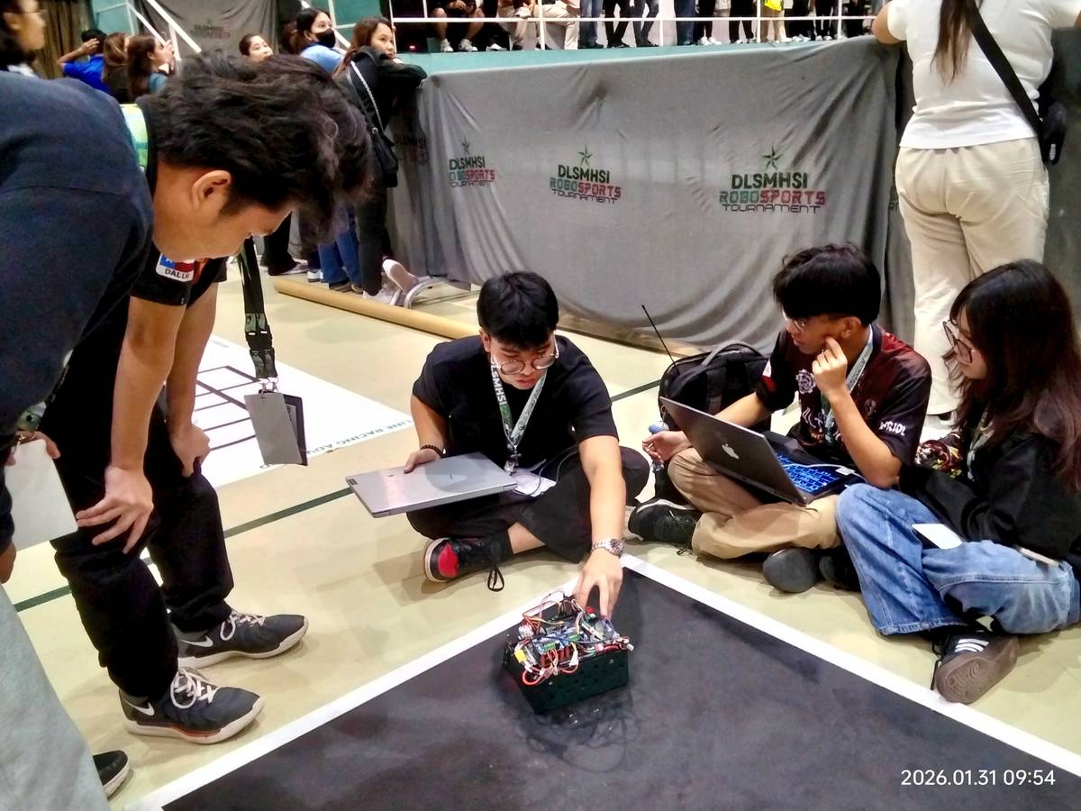 Cavite National High School students prepare for the BoxBot Auto competition. Their robot is placed under the 3 kilogram weight category.