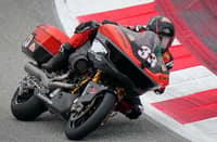 RIDER leans a Harley-Davidson bagger into a corner during on-track action from the Bagger World Cup grid.