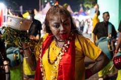 Hindu devotees pierce bodies with hooks, skewers