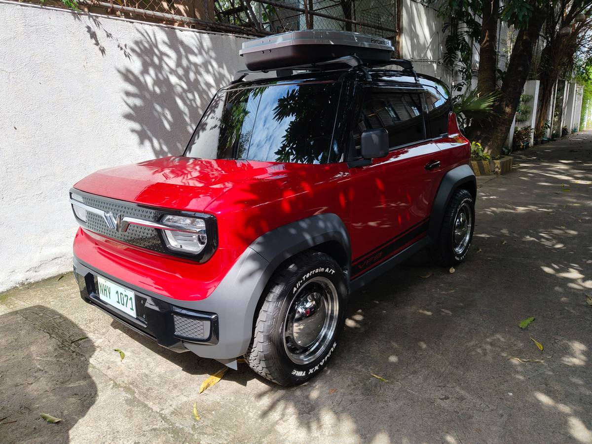 BOXY VinFast VF3 is parked on a residential street, one of the models offered under the battery subscription setup.