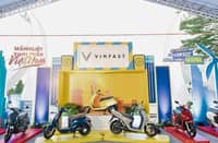 DISPLAY shows VinFast electric scooters lined up at a public showcase, which highlights the brand’s expanding two-wheeler lineup in Vietnam.