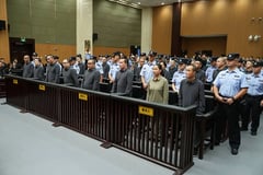 China executes 4 more accused Myanmar scam center leaders