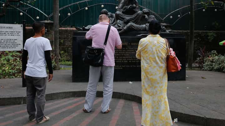 Tourists visit "Memorare," a sculpture by Peter De Guzman honoring the Filipinos who perished during the Battle of Manila, in Intramuros on Tuesday, 03 February 2026. The Walled City was among the areas most devastated by the Japanese Imperial Army during the month-long conflict with Filipino- American forces.