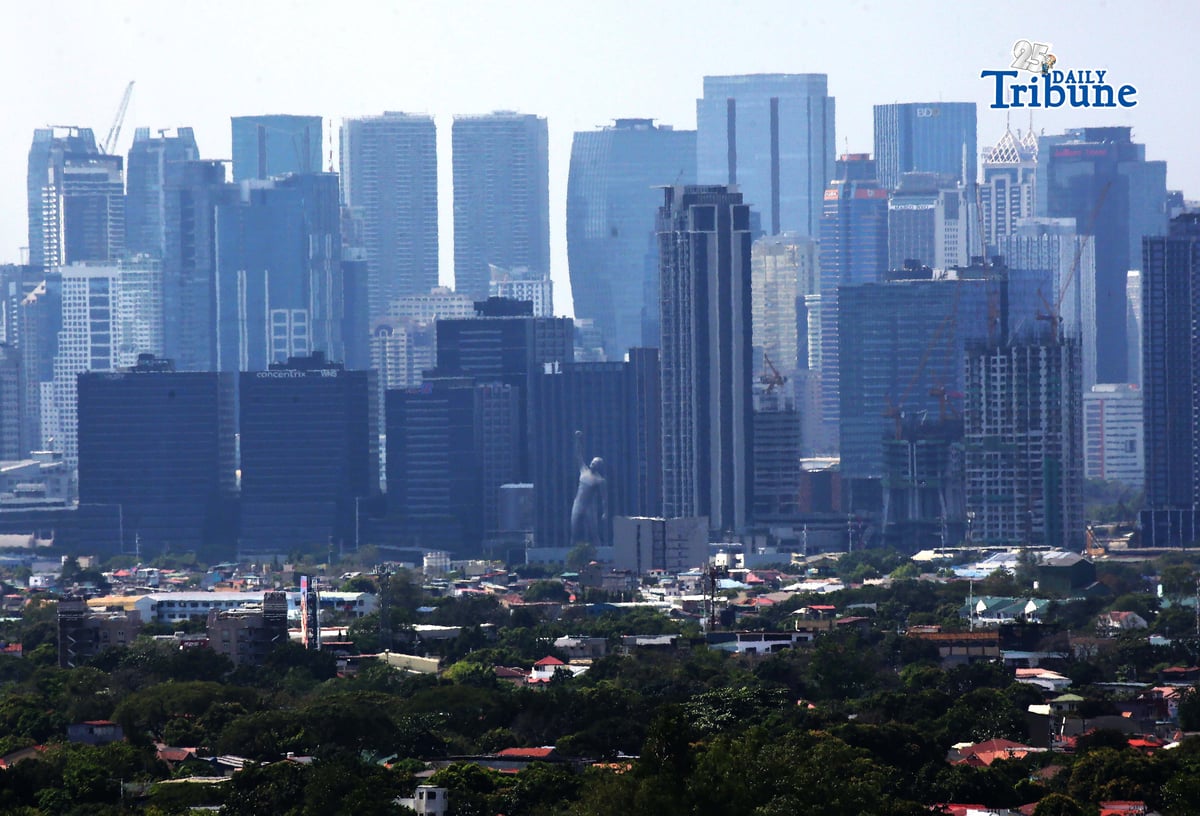 (February 03 2026) A 180 ft. statue of Victor and the high-rise buildings in Ortigas Center, seen from Antipolo City on Tuesday February 3 2026. The statue depicts a man with one arm raised as if it is celebrating a victory. Photo/Analy Labor