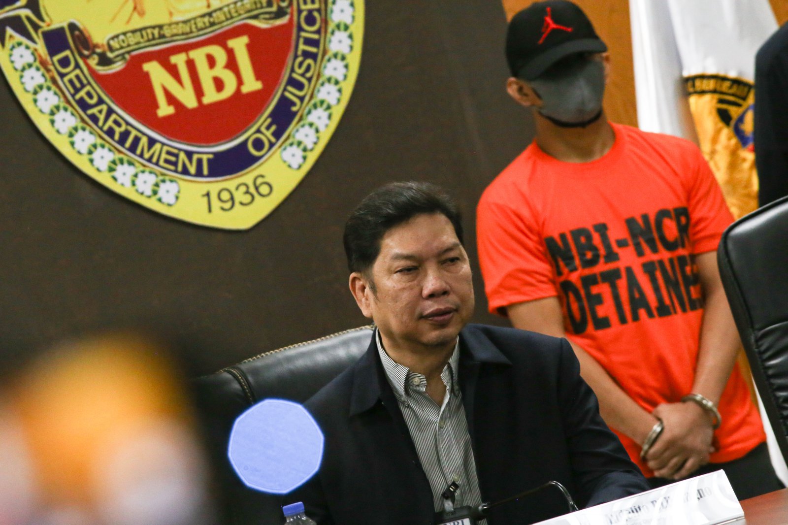 The National Bureau of Investigation (NBI), led by Director Angelito Magno, presents Patrolman Joshua Semilla Mendoza to the media during a press briefing at the NBI headquarters in Pasay City on 05 February 2026. Mendoza, a police officer accused of sexual assault, surrendered to the NBI and will be turned over to the proper court authorities for legal proceedings.