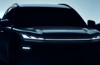 A GEELY SUV silhouette is shown during a preview as the brand outlines five new model launches planned for 2026.
