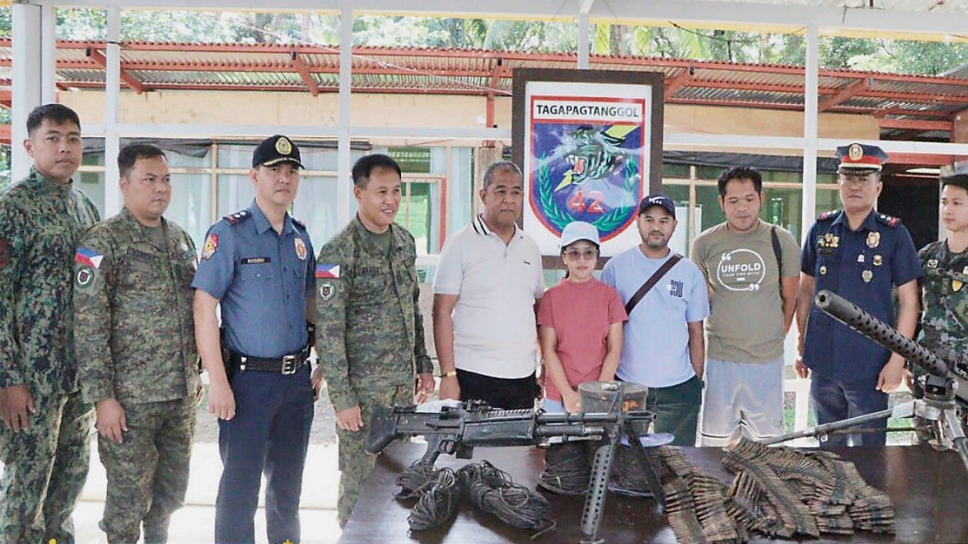 Former insurgents surrender firearms, explosives