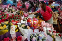 Personnel prepare flower bouquets for sale at a flower shop in Araneta City, Cubao, Quezon City, on Saturday, 7 February 2026, as Valentine’s Day approaches and demand for bouquets rises, with flowers among the most popular gifts for the occasion