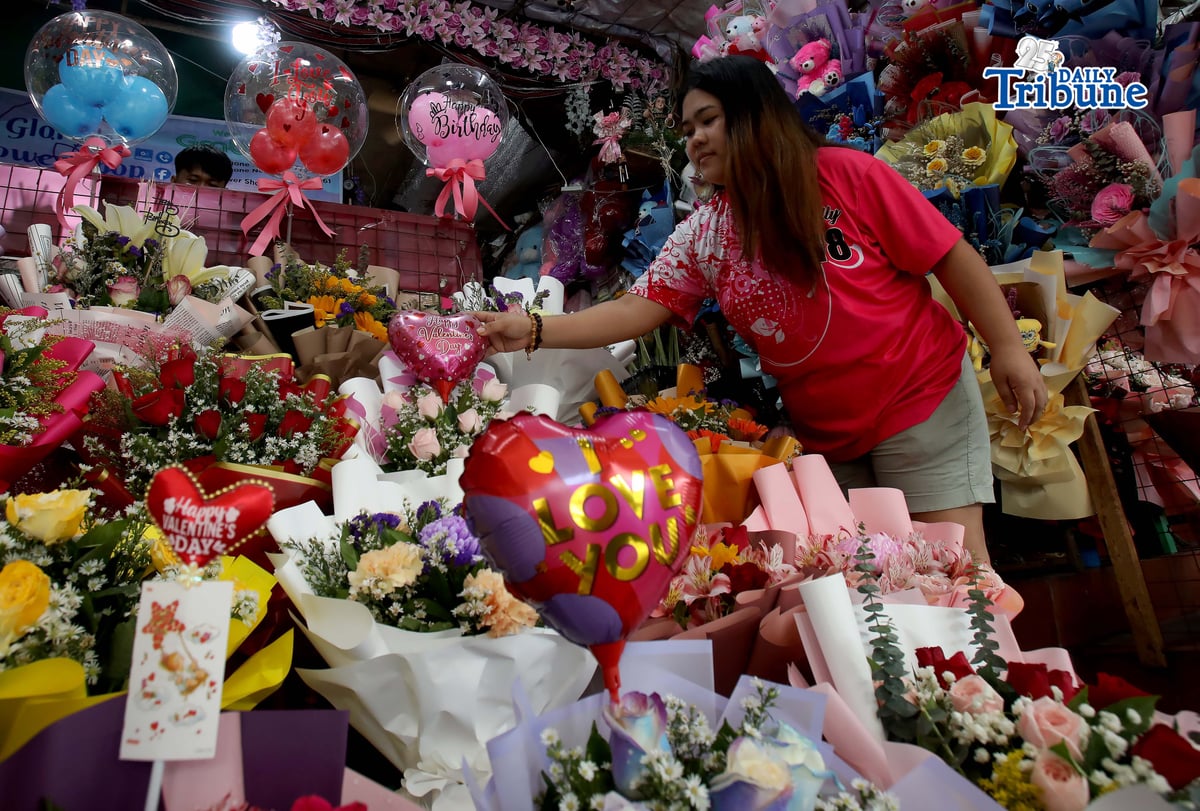 Personnel prepare flower bouquets for sale at a flower shop in Araneta City, Cubao, Quezon City, on Saturday, 7 February 2026, as Valentine’s Day approaches and demand for bouquets rises, with flowers among the most popular gifts for the occasion.