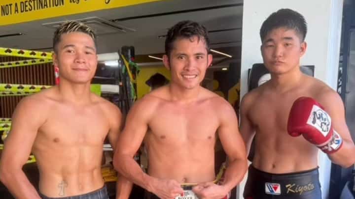 WBC champion Melvin Jerusalem (center) proudly strikes a pose with his two sparmates in Cebu City.