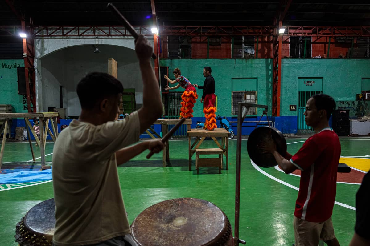 Jhayvee Sicat and King Noah rehearse their lion dance performance in preparation for an upcoming competition. Aside from competing, the troupe also performs at Chinese cultural events like business openings, weddings and birthdays.