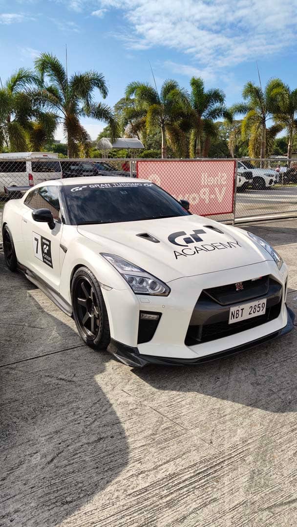WHITE Nissan GT-R from the GT Academy fleet sits on the pit lane at Clark International Speedway.
