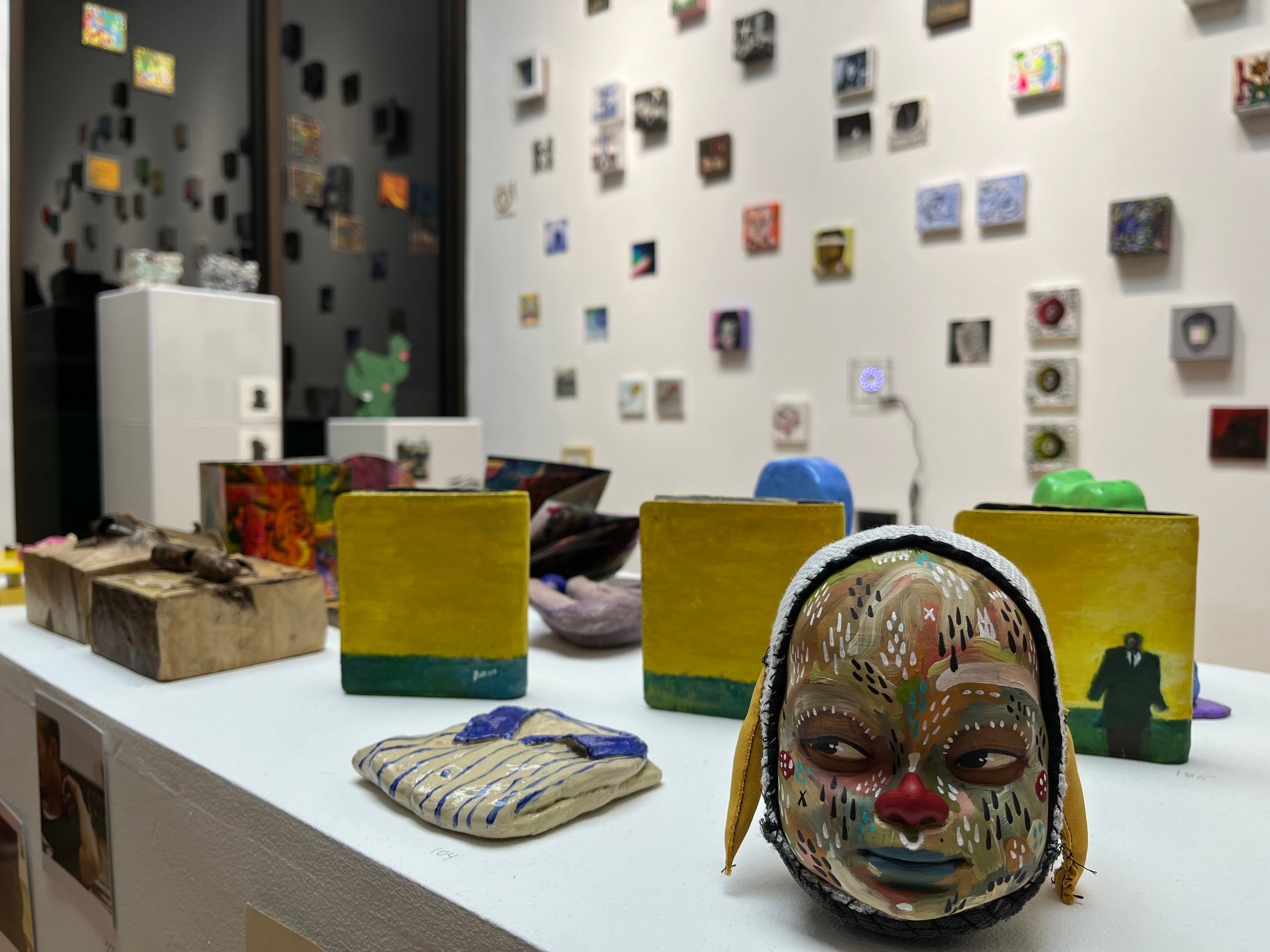 WORKS crafted in various mediums, including ceramics, wood and leather wallets.