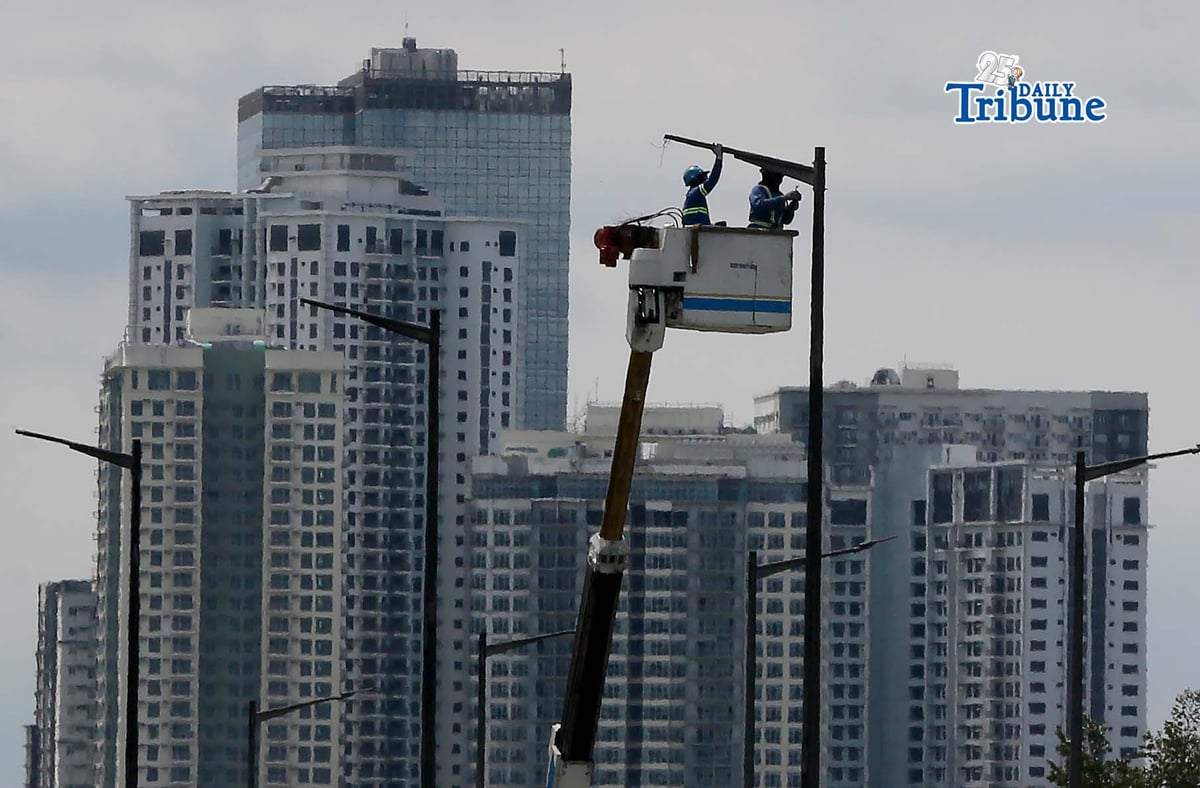 Workers install streetlights