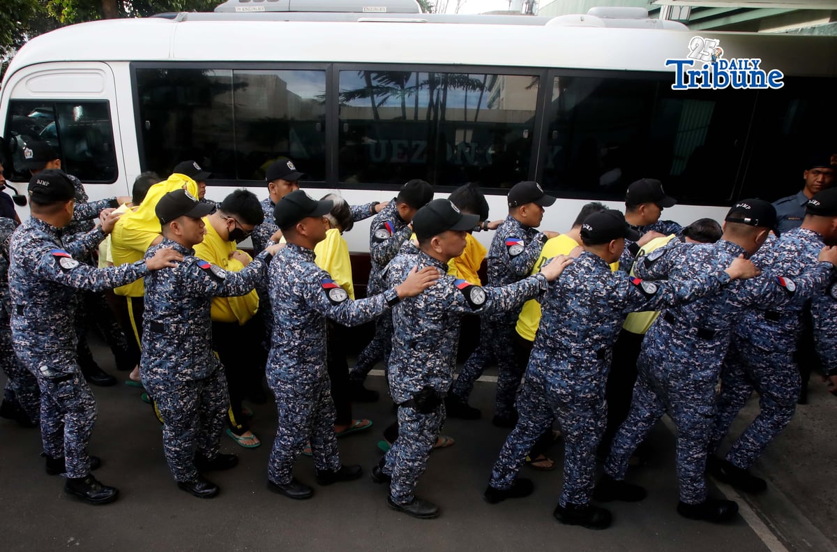 Bureau of Jail Management and Penology (BJMP) personnel heavily guarded former Senator Ramon “Bong” Revilla Jr., along with 15 co-accused, as they arrived at the Sandiganbayan in Quezon City on Monday, February 9, 2026, to attend the hearing on their malversation and graft cases over alleged anomalous flood control projects. Photo/Analy Labor