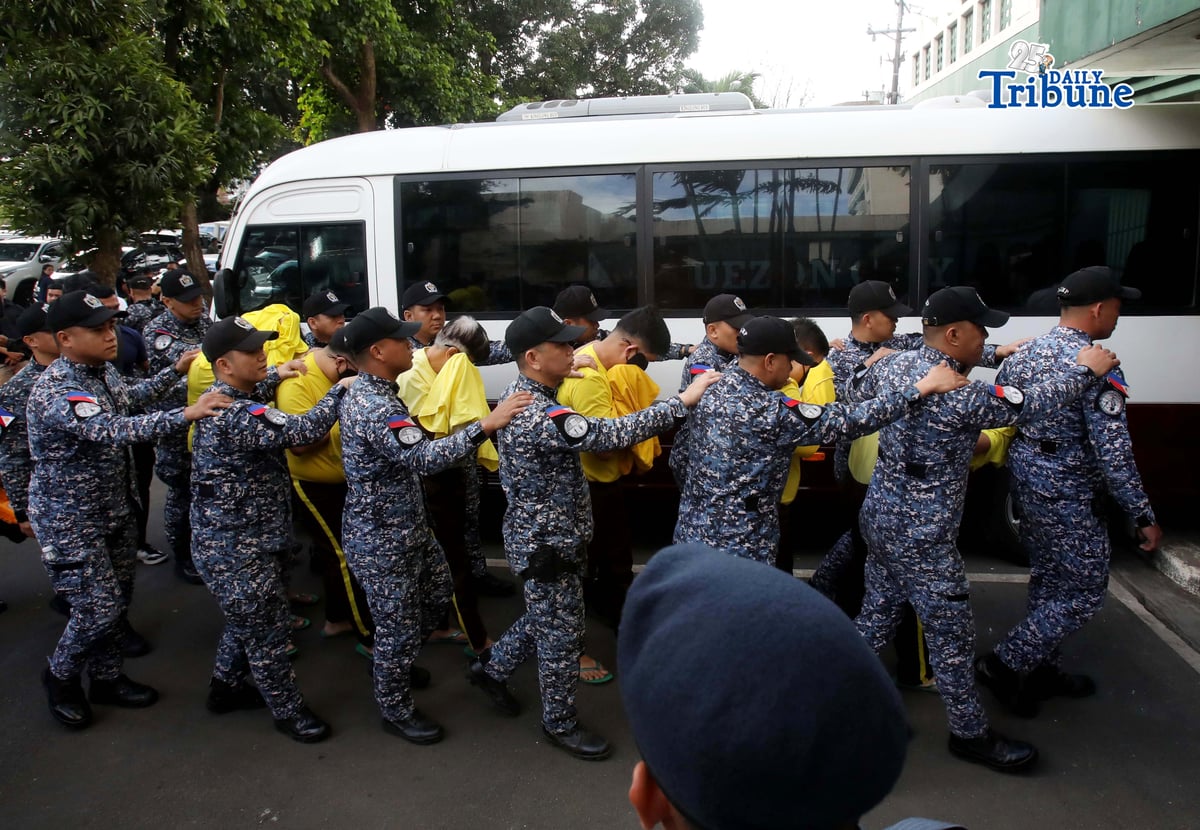 Bureau of Jail Management and Penology (BJMP) personnel heavily guarded former Senator Ramon “Bong” Revilla Jr., along with 15 co-accused, as they arrived at the Sandiganbayan in Quezon City on Monday, February 9, 2026, to attend the hearing on their malversation and graft cases over alleged anomalous flood control projects. Photo/Analy Labor