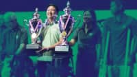 RONIN Leviste receives the trophy after he and his guest partner, Darren Flores, emerged as the lowest net champion in the 38th Mango Tee. The Alabang Country Club Inc. board of directors eventually withdrew his award due to their ‘highly unusual and statistically improbable’ scores.