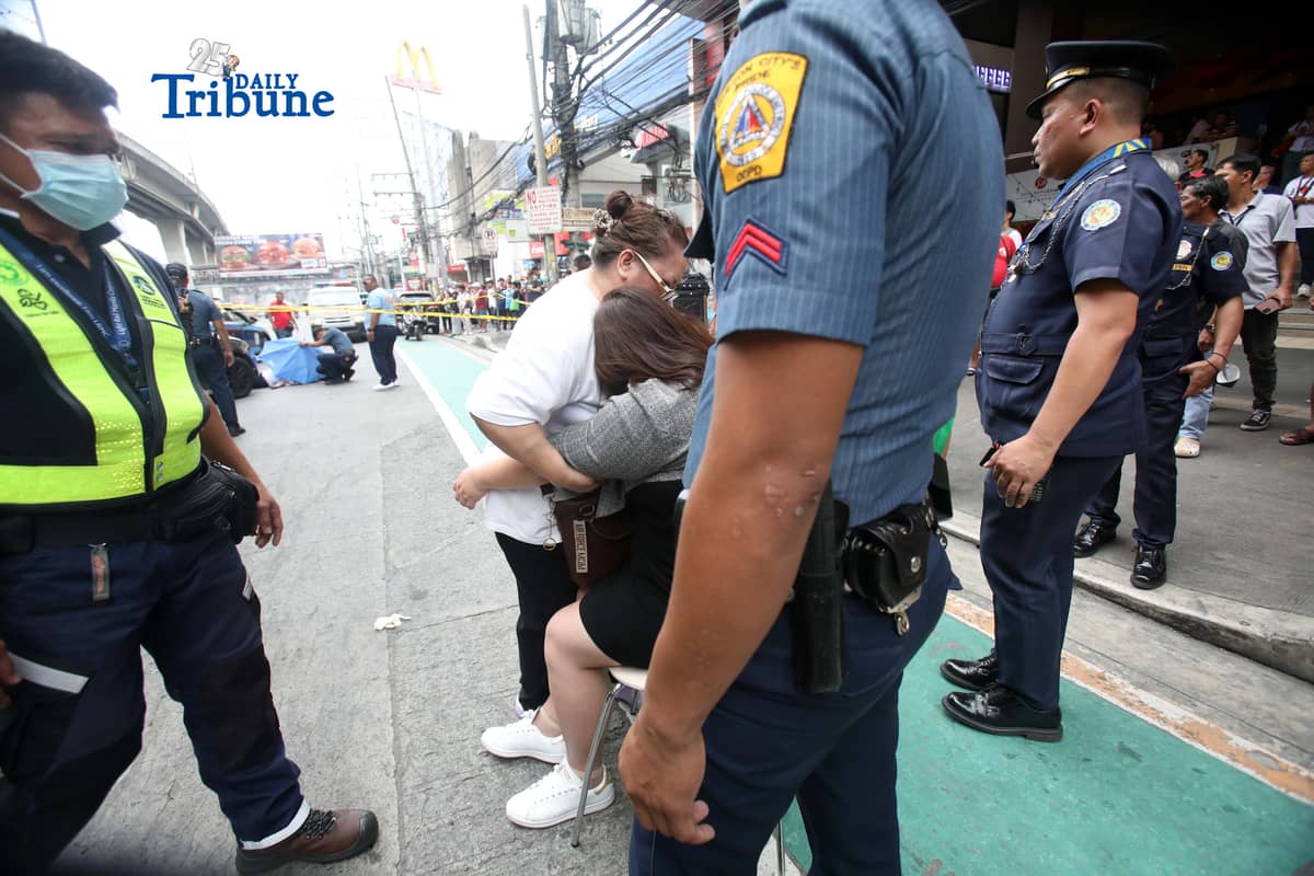 (February 11 2026) Relatives of the college male student died after jumping from LRT Fernando Poe Jr. Station station northbound platform to the street level of Epifanio Delos Santos Avenue (EDSA), and dragged by a passing vehicle after he jumped, emotional when they arrive in the area and see the lifeless body of their loved ones. Photo/Analy Labor