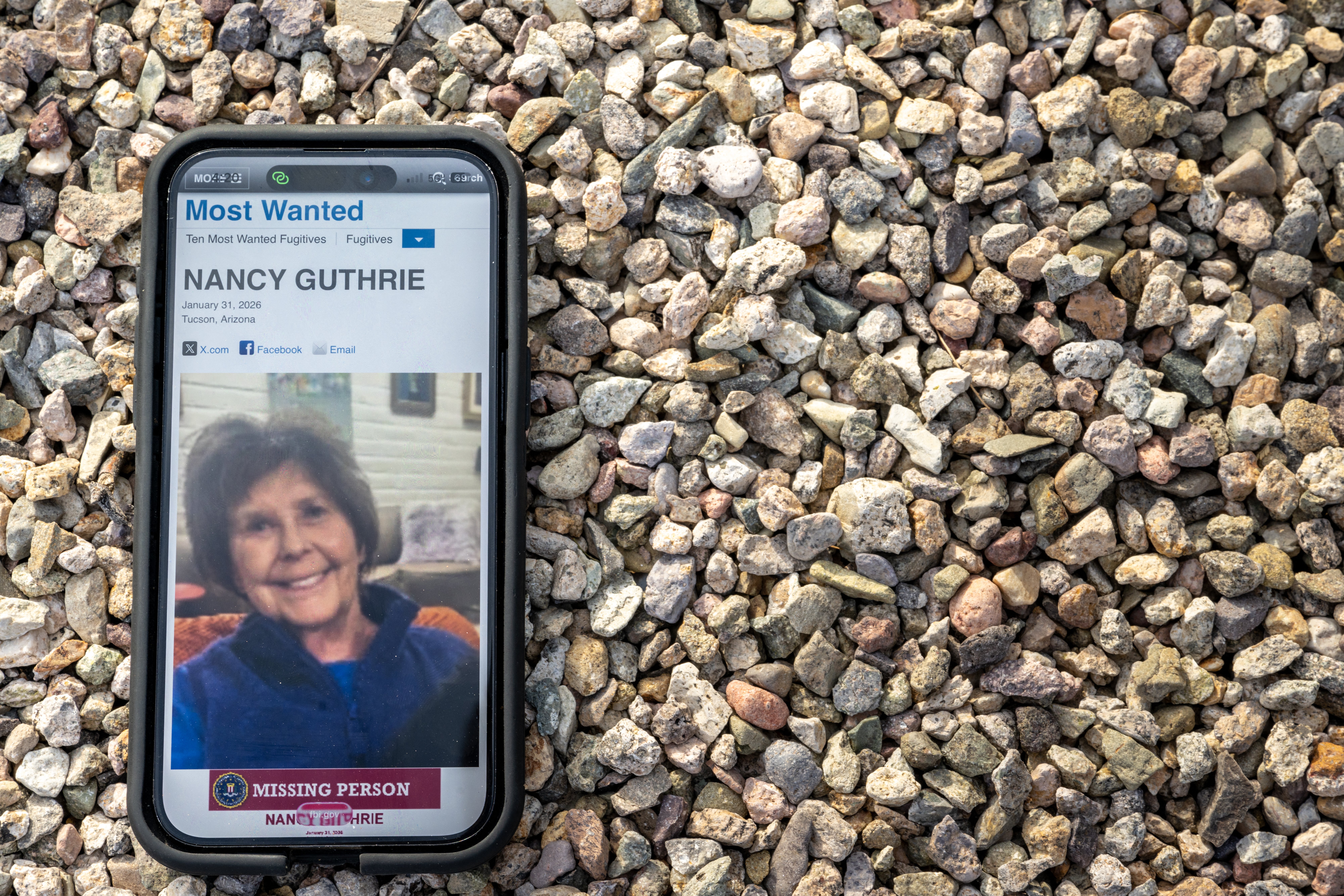 UCSON, ARIZONA - FEBRUARY 10: In this photo illustration, Nancy Guthrie is seen on the FBI website on a cellular phone February 10, 2026 in Tucson, Arizona. Searches continues for Nancy Guthrie, the 84-year-old mother of U.S. journalist and television host Savannah Guthrie, after she went missing from her home on the morning of February 1st. Guthrie's possible abductors had set a deadline of 5pm on February 9 for a $6 million payment.