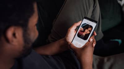 A MAN using a dating app.