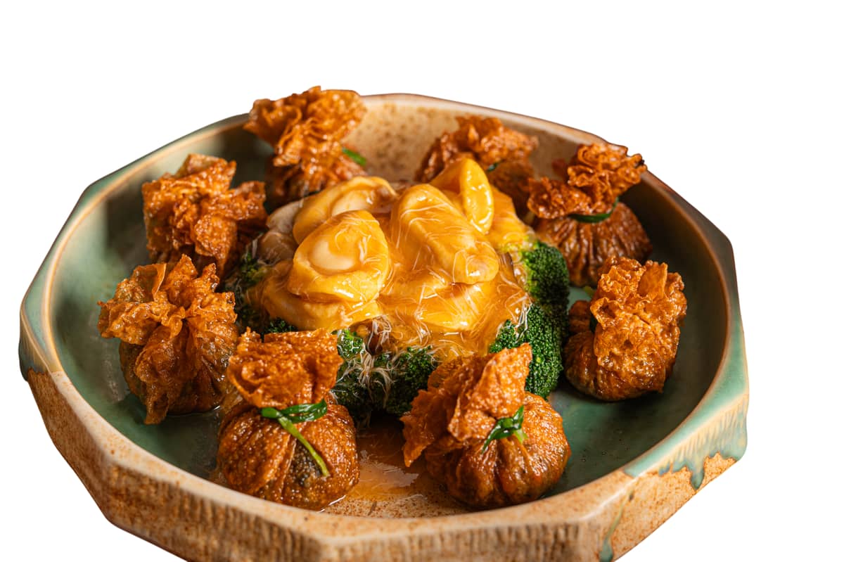 BRAISED 10-head abalone, sea cucumber and dry oyster money bag crab roe sauce.
