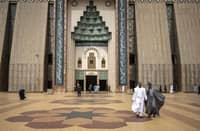 Muslim worshippers walk out of Abuja National Mosque after attending the Friday prayers in Abuja, Nigeria.