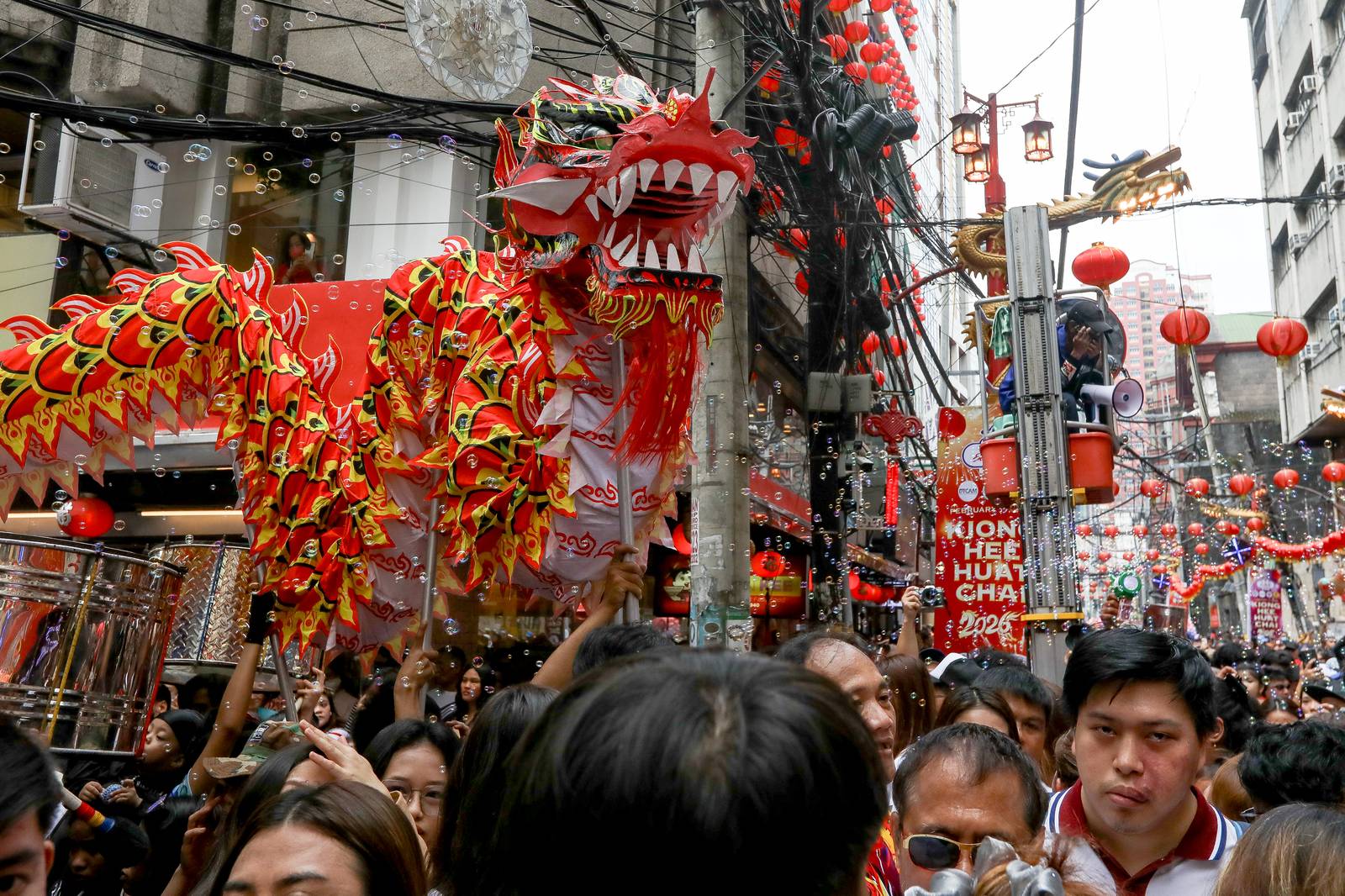 Dragon dancers are seen amid crackling fireworks outside a local supermarket in Chinatown, Binondo, Manila, in celebration of the Lunar New Year on Tuesday, 17 February 2026.| Aram Lascano/DAILY TRIBUNE