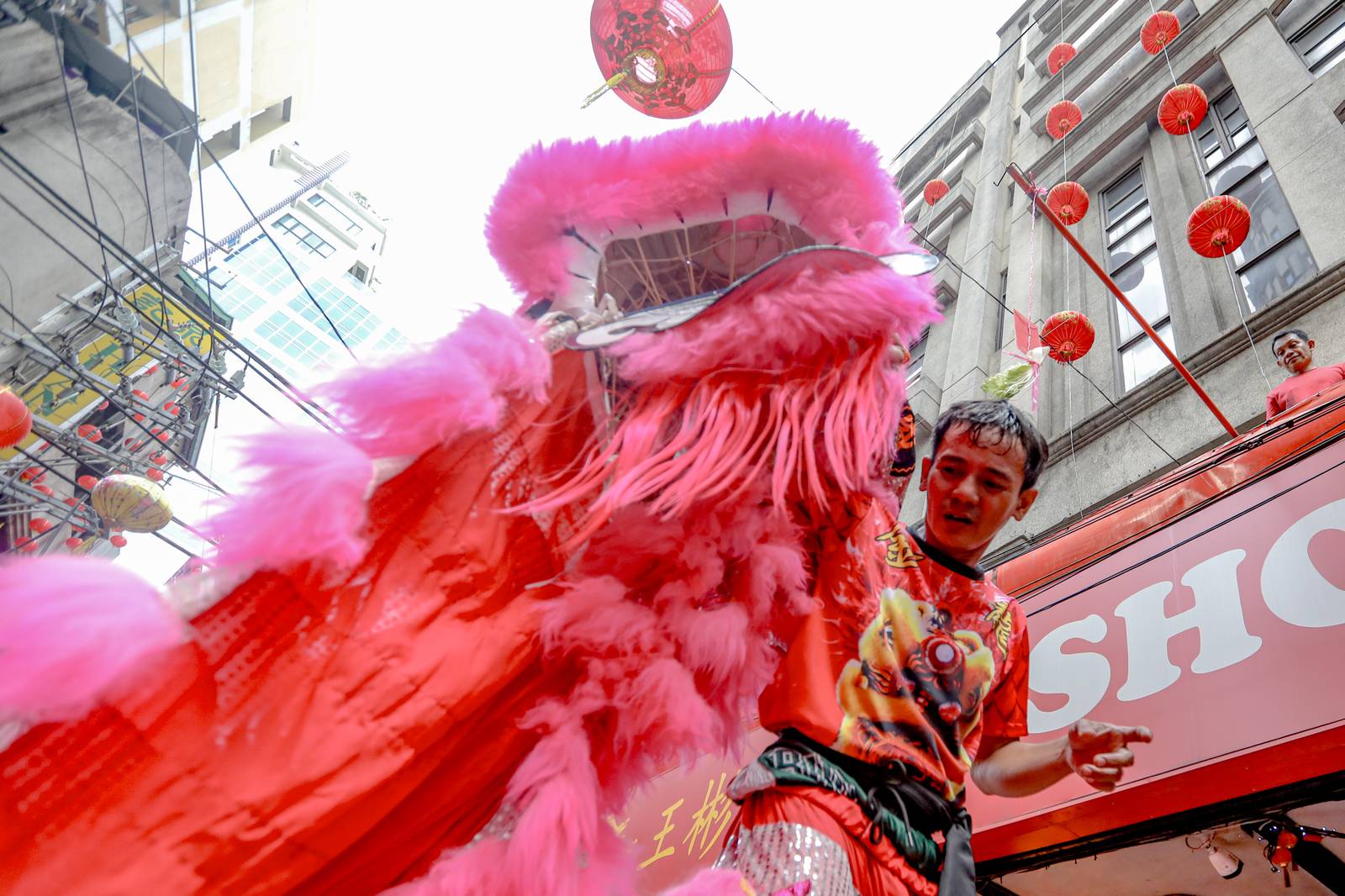 Dragon dancers are seen amid crackling fireworks outside a local supermarket in Chinatown, Binondo, Manila, in celebration of the Lunar New Year on Tuesday, 17 February 2026.| Aram Lascano/DAILY TRIBUNE