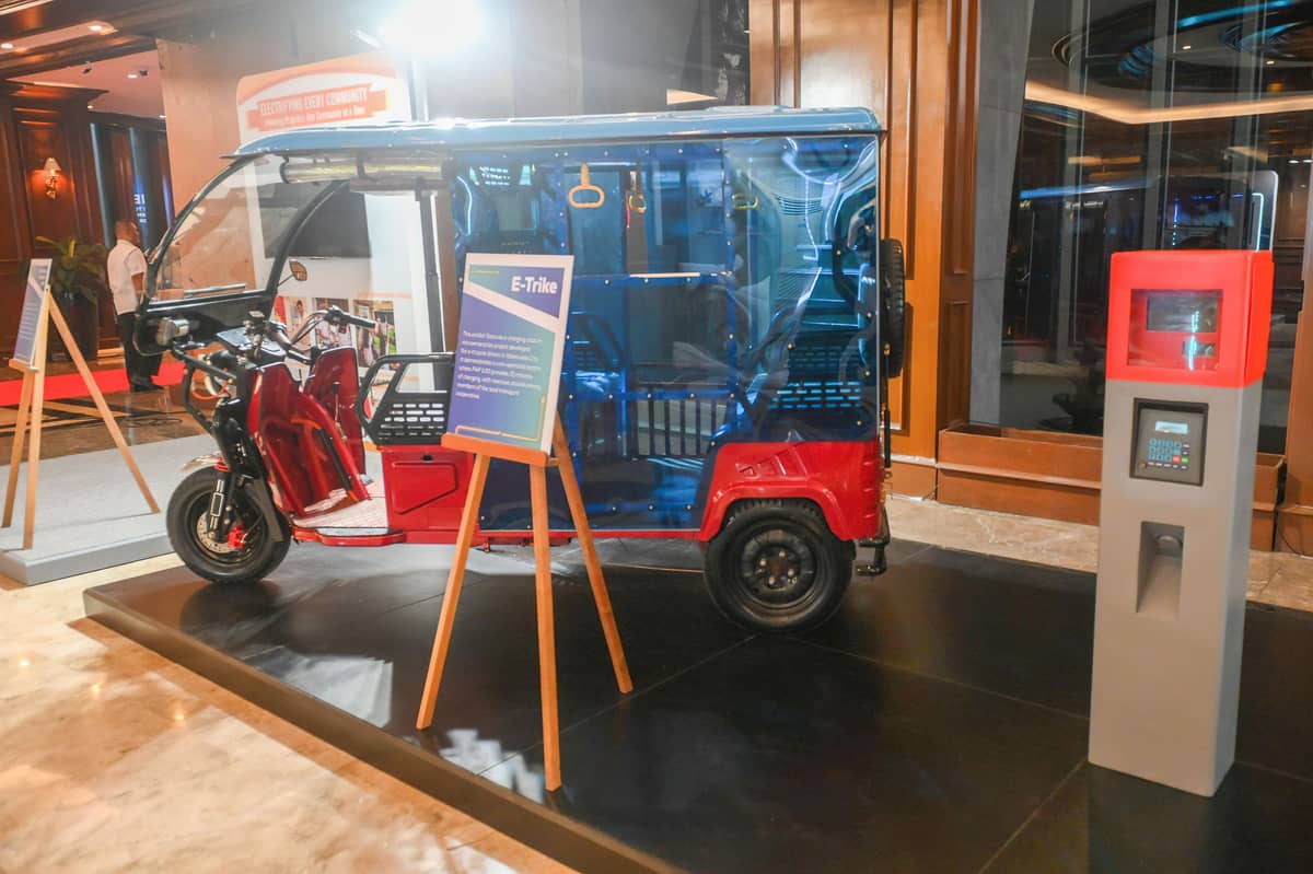 SHOWCASE of innovation and community partnership. Meralco featured various innovations and community partnerships in an exhibit that highlights its support for the National Energy Agenda. Seen in the photo are an e-trike charging station in Valenzuela City, and technology demonstrations including smart-home energy flow simulations.