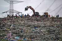 A HEAVY machinery is leveling a massive pile of waste at the Cipayung landfill in Depok, West Java, which often slides and clogs the river, sending waste to the outskirts of Jakarta during heavy rains.
