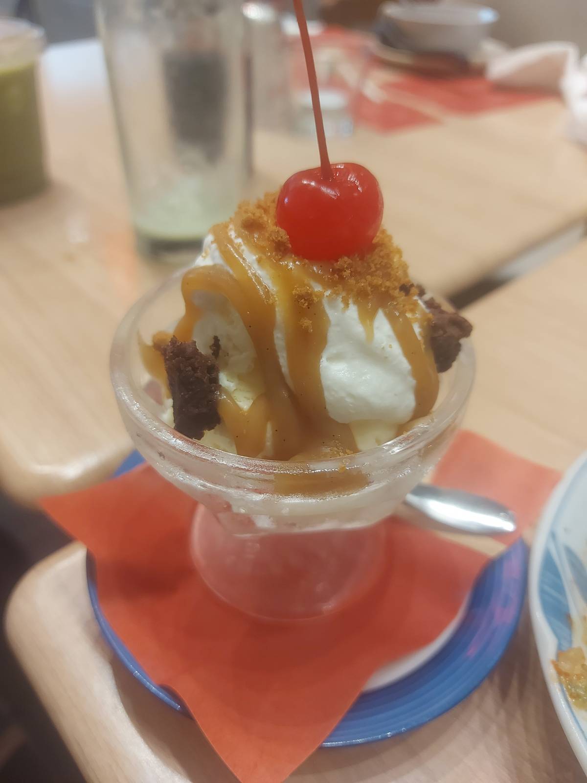 CHERRY-topped vanilla ice cream.