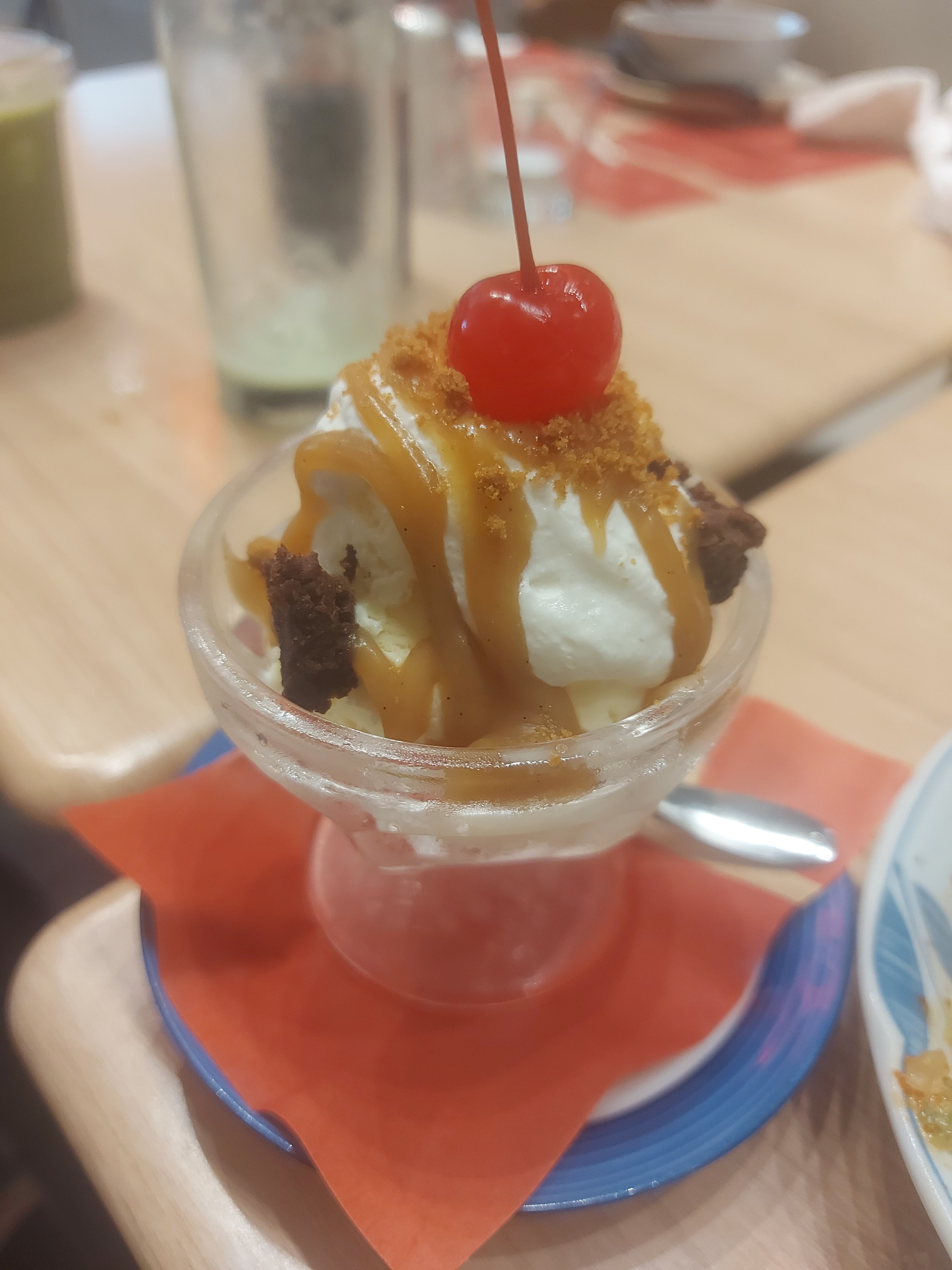 CHERRY-topped vanilla ice cream.